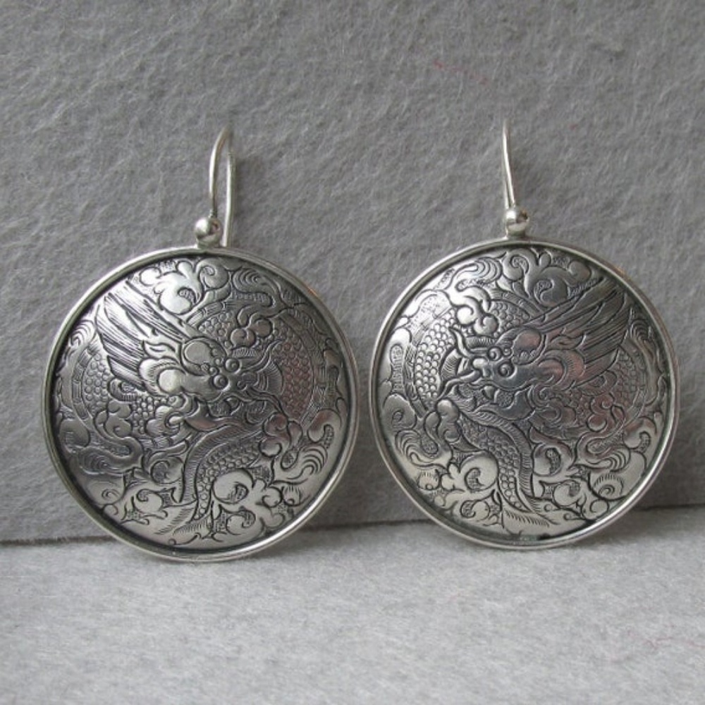 Retired Silpada siler Dragon Hoop earrings